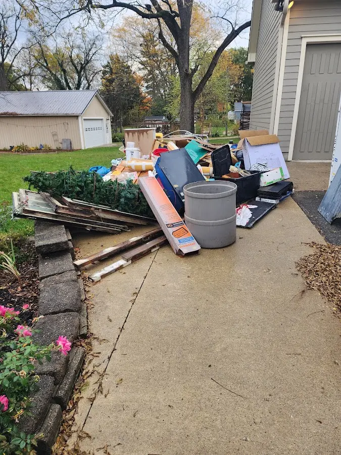 Dumpster being loaded with debris for 10 Yard Dumpster Rental in Bushkill